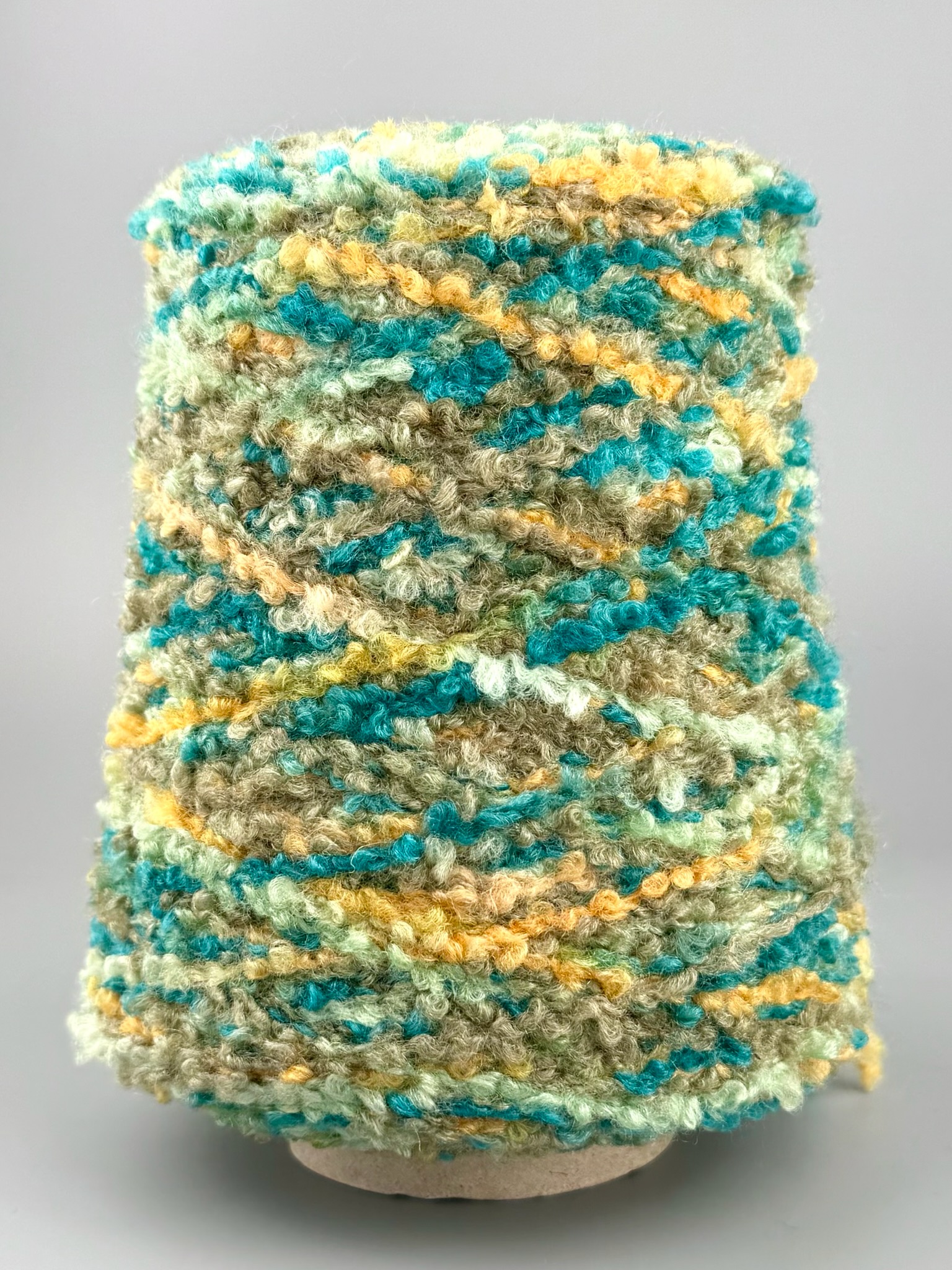 Corallo Bouclé 240m/100g – Merino Extrafine und Seide mit Elastan Oliv-Türkis Melange foto 2